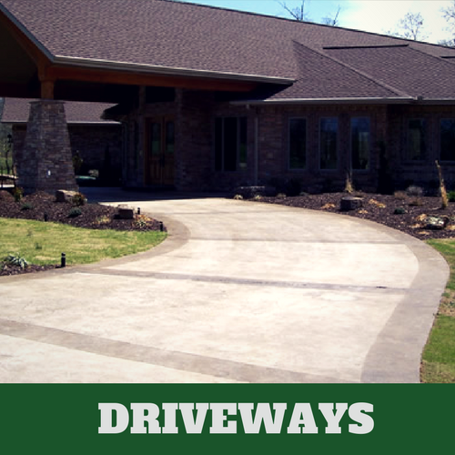 Two toned colored concrete driveway in Franklin, TN with brick home.