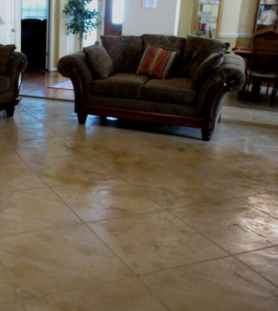 Interior concrete floors that are polished and cut to resemble ceramic tile.