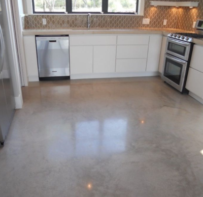 Fun designed kitchen floor made out of polished concrete.